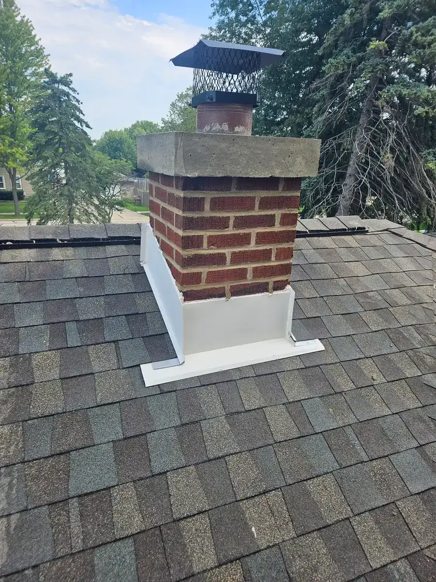 Rebuilt brick chimney with new crown and flashing