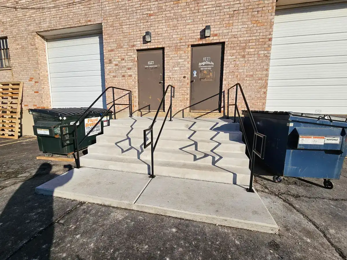 Commercial concrete steps rebuilt with new steel railings