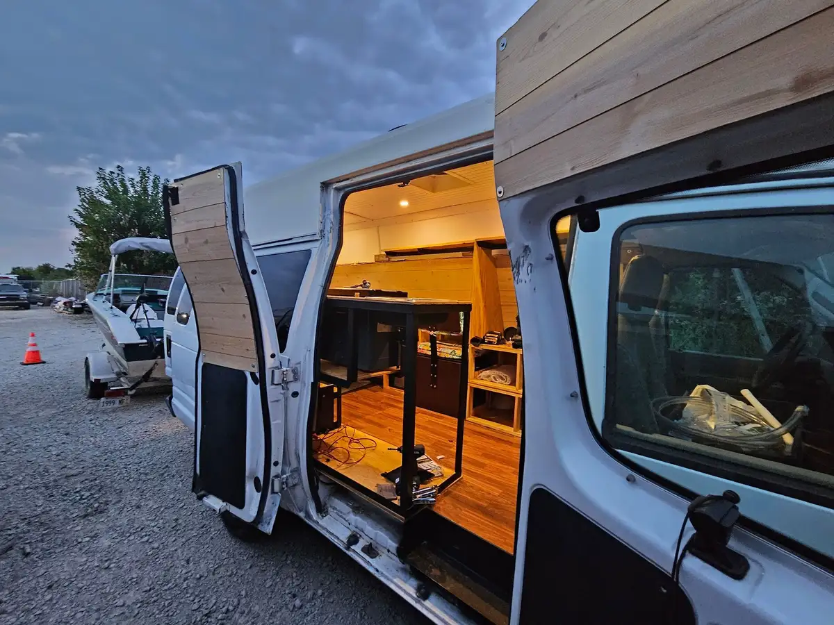Custom camper van build with wood interior
